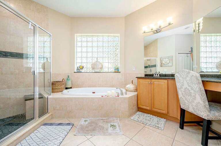 Large Main Bathroom with Garden Tub and Shower as well as Sinks