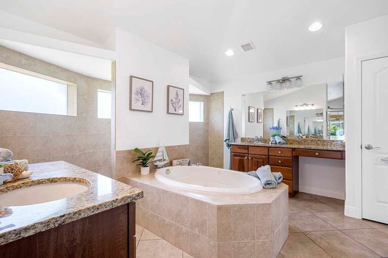 Main En-Suite Bathroom Features His and Her Sinks and Garden Tub in the Center