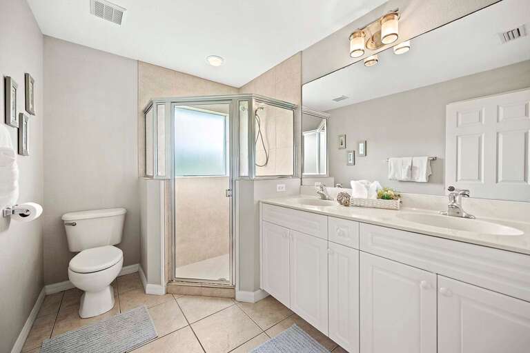 Hallway Bathroom with Shower and Dual Sinks