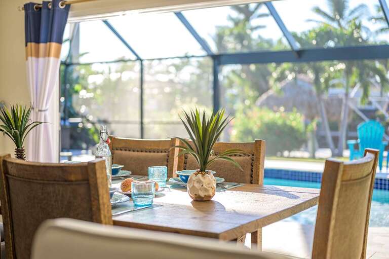 Western Facing Dining Room with Pool and Canal View