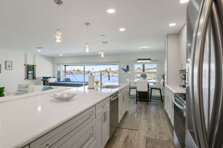 View from the Kitchen to the Dining Area, Pool and Large Canal Basin