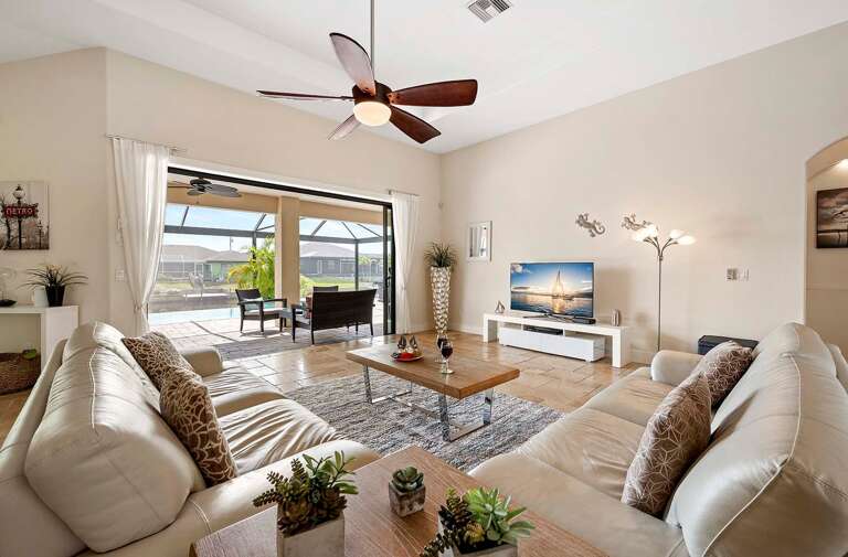 Living Room with Comfortable Couches and Great Views of the Pool and Lanai