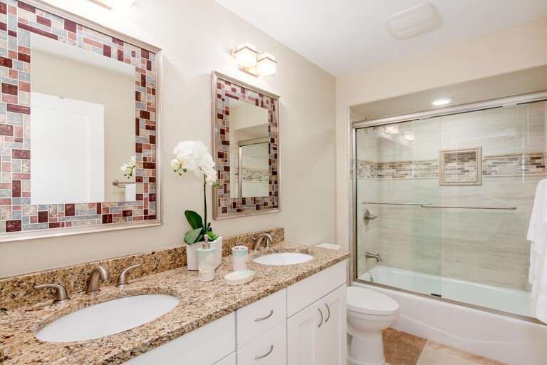 Hallway Bathroom for King And Queen Bedroom with Dual Sinks and Shower Tub Combo
