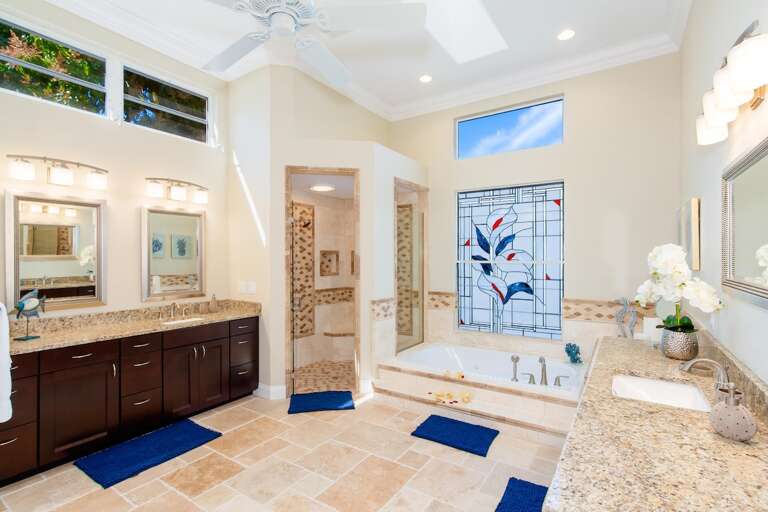 Main En-Suite Bathroom with Sunken Tub and Walk in Shower as well as His and Hers Sinks