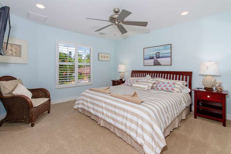 2nd bedroom upstairs features a king size bed, walk in closet and TV