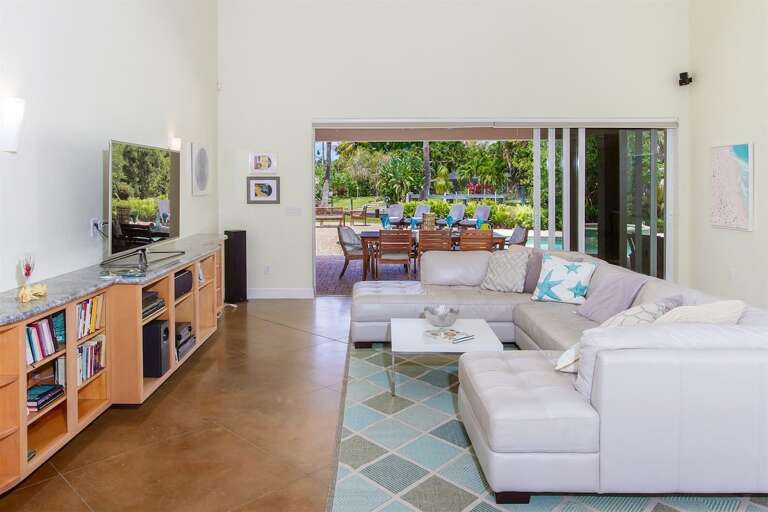 Living Room with view to pool area and cozy couch