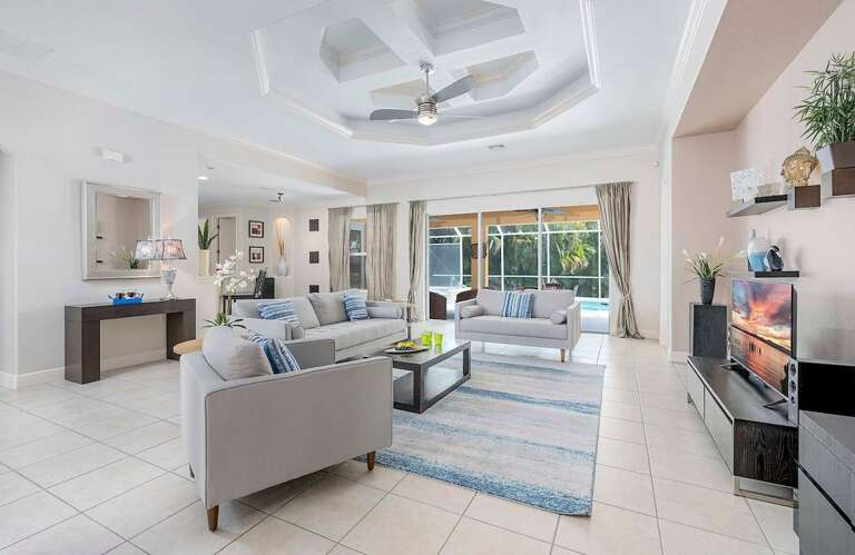 Living Room with Beautiful Views to Pool Area and Access to Patio