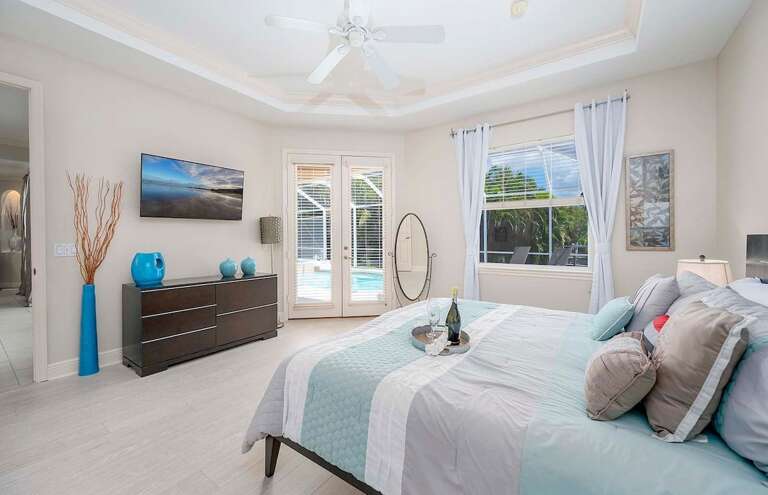 Main Bedroom with King Bed and Access to Pool Area