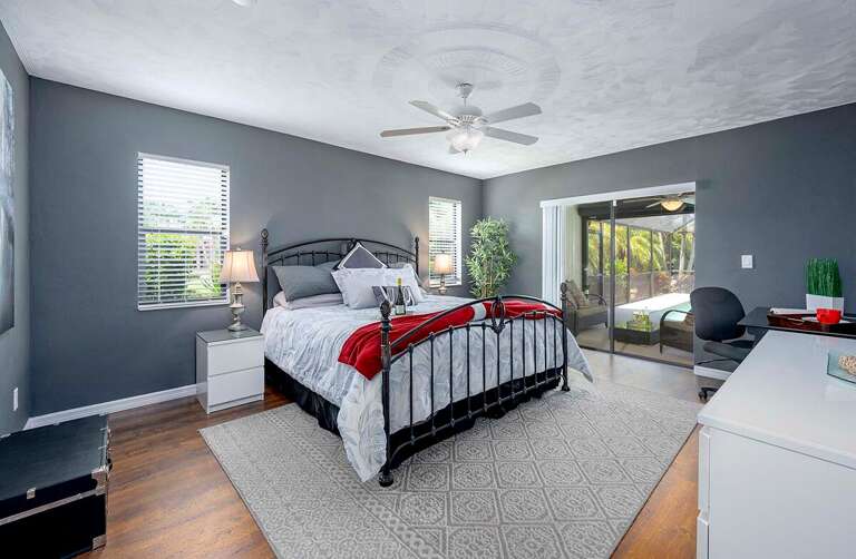 Main Bedroom with Access and View to Pool Area