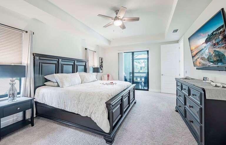 main Bedroom with King Size Bed and Patio Access