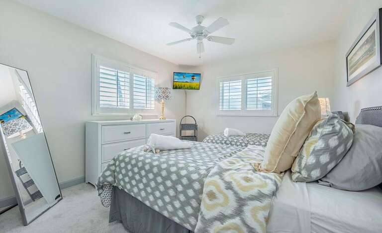 Guest Bedroom Features 2 Twin Beds and Pool View