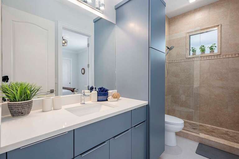 Guest Bathroom and En-Suite to Queen Bedroom with Walk in Shower