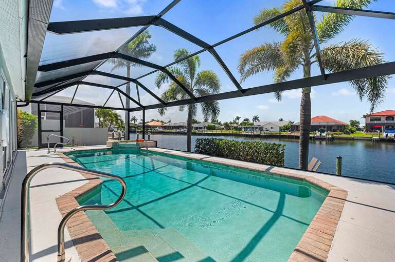 Steps to Lead into the Pool Opening Up the View with Large Picture Window Screen