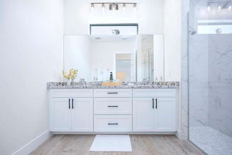 Guest Bathroom with Dual Sinks and Walk in Shower