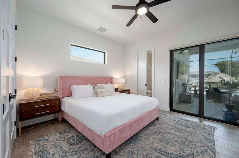 Guest Bedroom with King Bed and Small En-Suite Bathroom and Pool/Patio Access