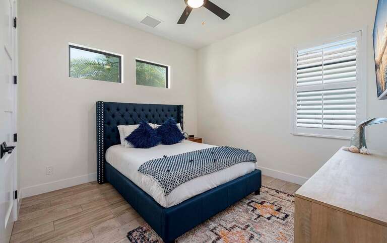 Guest Bedroom with Queen Bed and Garden View