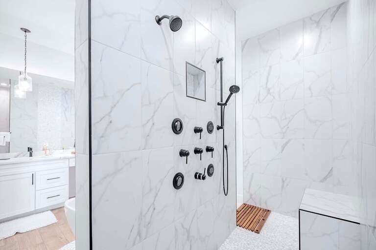 Main Bathroom with Wrap Around Shower and Multiple Shower Heads