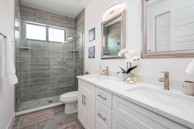 Guest Bathroom with Dual Sinks and Shower