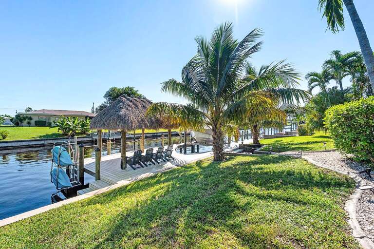 Backyard with Tiki Hut and Kayaks