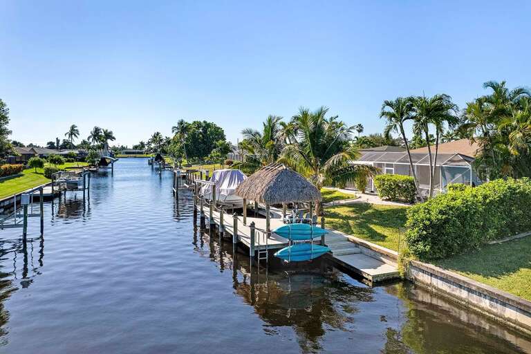 Gulf Access Canal with Tiki Hut and Boat Dock