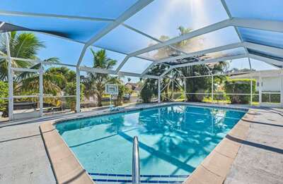 White Sea Shell North Eastern Facing Pool with Lush Landscape