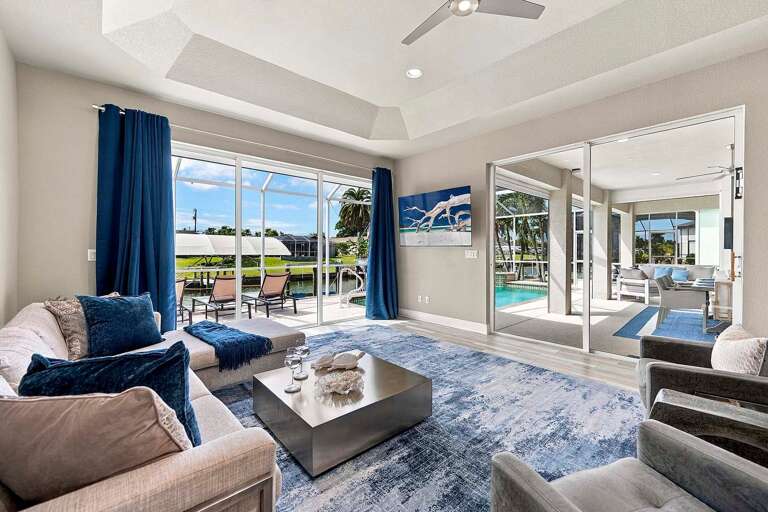 The Living Room at Seva Retreat Offers Views of the Canal and Pool