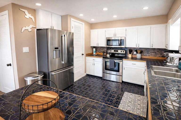 Sleek Kitchen, Shiny Surfaces, Stainless Steel Appliances