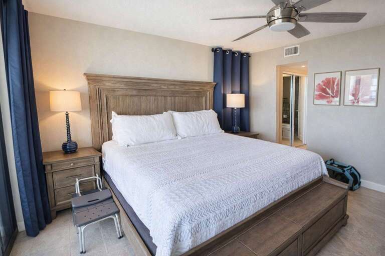 Bed, Lamps, Curtains, Fan, Framed Art