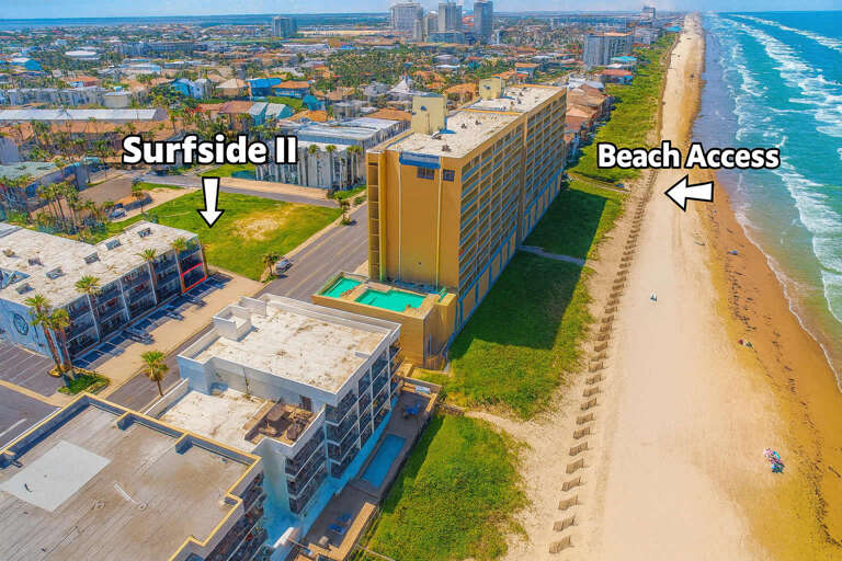 Shoreline Stretch, Sunlit Structures, Sandy Beach Pathway