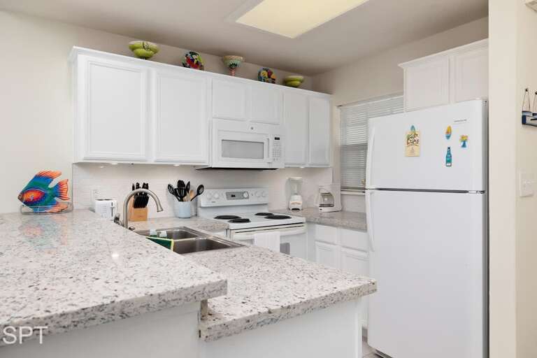 Vacation Rental Kitchen With Sparkling Surfaces And Spacious Setup