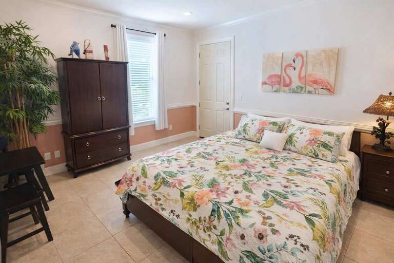 Blossoming Bedspread, Flamingo Art, Wooden Wardrobe, Leafy Plant, Soft Lighting