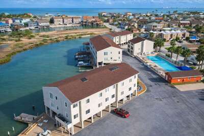 * Boat Slip * Waterfront Pool * Bay Sunset Views