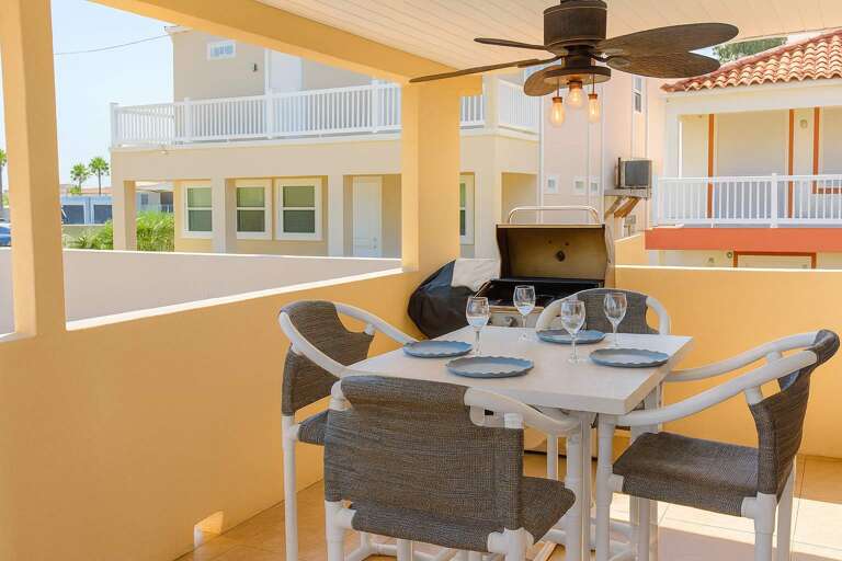 Sunny Terrace With Table, Chairs, Grill, And Fan