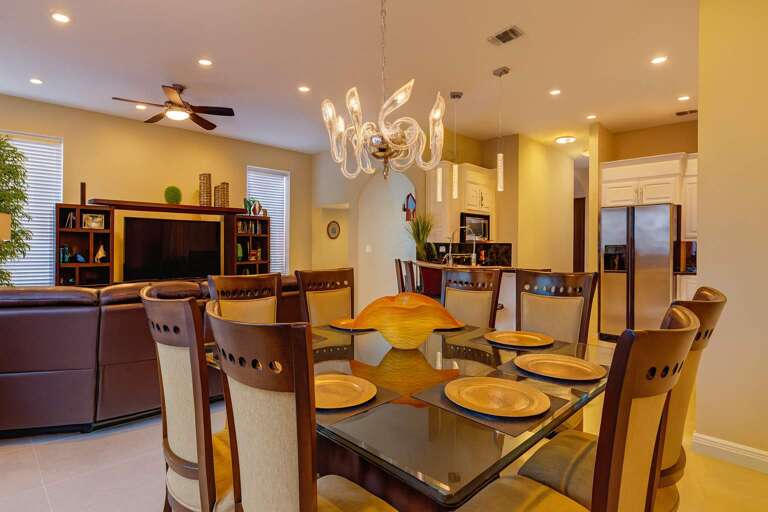 Dining Table, Elegant Chairs, Stylish Chandelier, Open Kitchen, Living Area