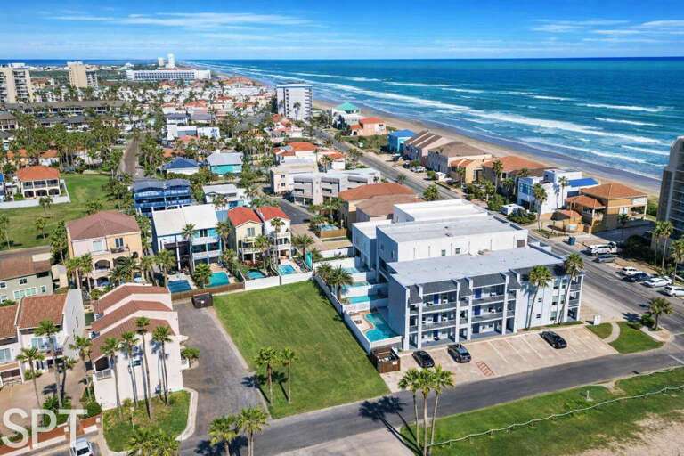 Coastal Buildings Beside Azure Ocean Waves
