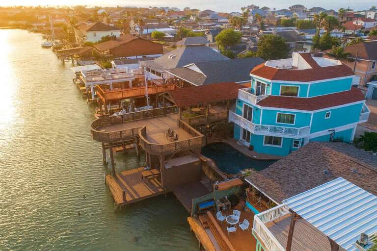 Colorful Coastal Homes By The Shimmering Shoreline