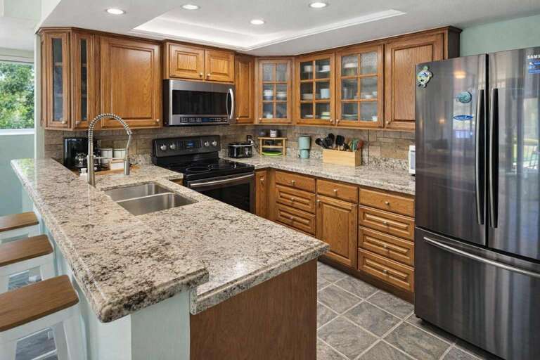 Granite Gleams, Cabinets Cluster, Stainless Steel Shines