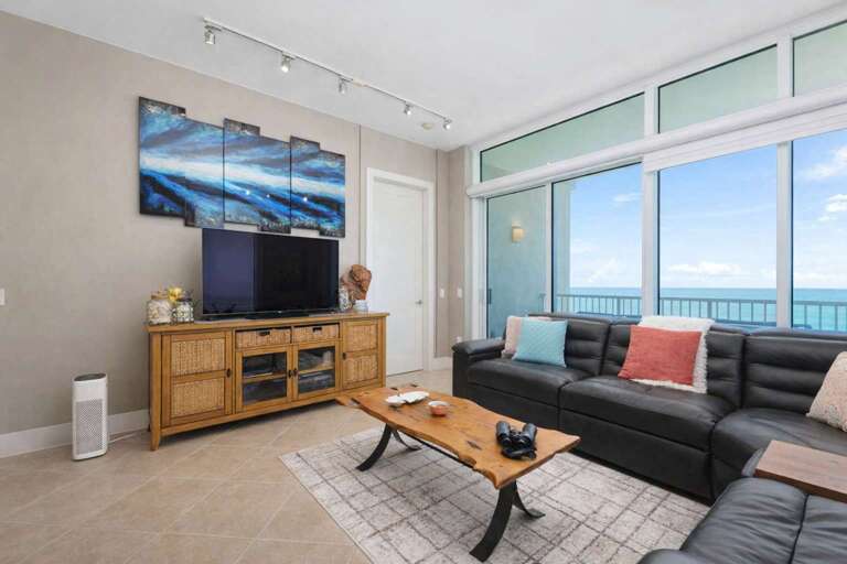 Living Room With Leather Sofas, Large TV, Ocean View
