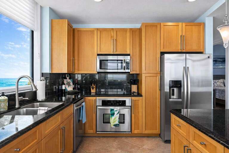 Kitchen With Wooden Cabinets, Stainless Steel Appliances, Ocean View
