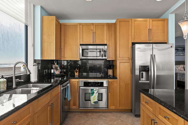 Spacious Kitchen With Stainless Steel Appliances In Seaside Vacation Rental