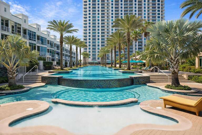 Serene Swimming Pool, Palm-lined Path, Towering Building Backdrop