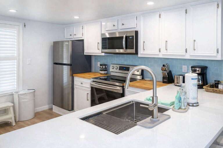 Sleek Stainless Steel Sink, Shimmering Surfaces, Spacious Shelves
