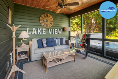 Porch With Plush Pillows, Paddle Decor, And Screen Showing Serene Scene