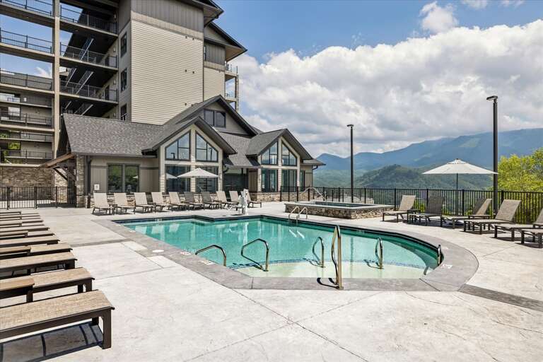 Building Beside Blue Pool, Mountains In Distance Building Beside Blue Pool, Mountains In Distance