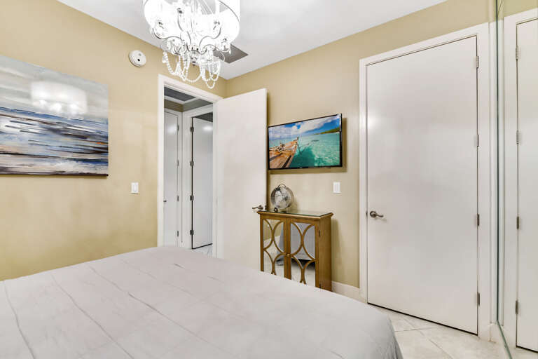 Guest bedroom with TV so you can enjoy sports and shows in the privacy of a dark inside bedroom.