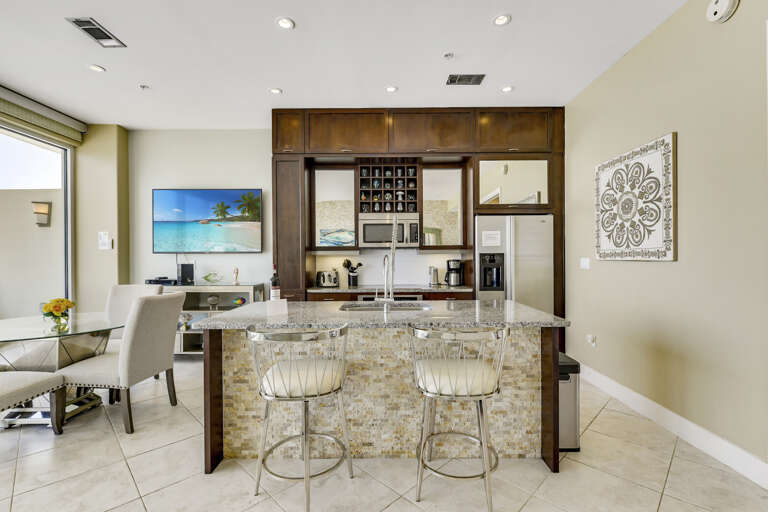 Fully-equipped kitchen with refrigerator, microwave, Keurig, coffee pot, dishwasher, garbage disposal.  Indoor dining!  75-inch LG Smart TV!