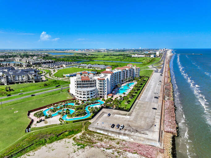 Overview showing lazy river, pools, and beach access.