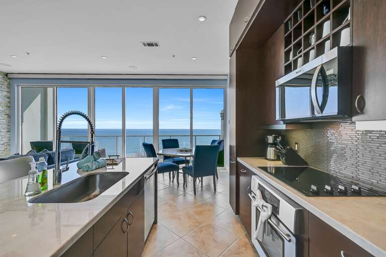 Kitchen, microwave, toaster, Keurig, coffee pot, tea kettle, dishwasher, stove top, oven, view