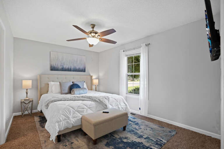 Master bedroom with a king size bed Master bedroom with a king size bed
