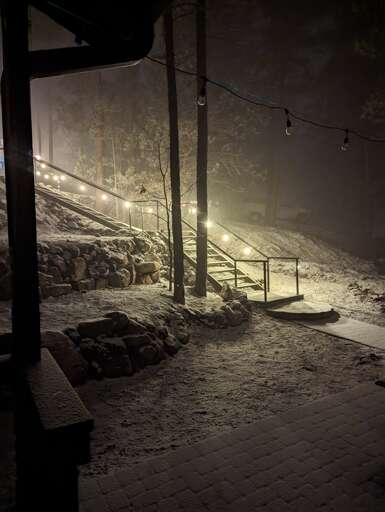 Well-lit stairway entrance, enjoy some snowy nights.